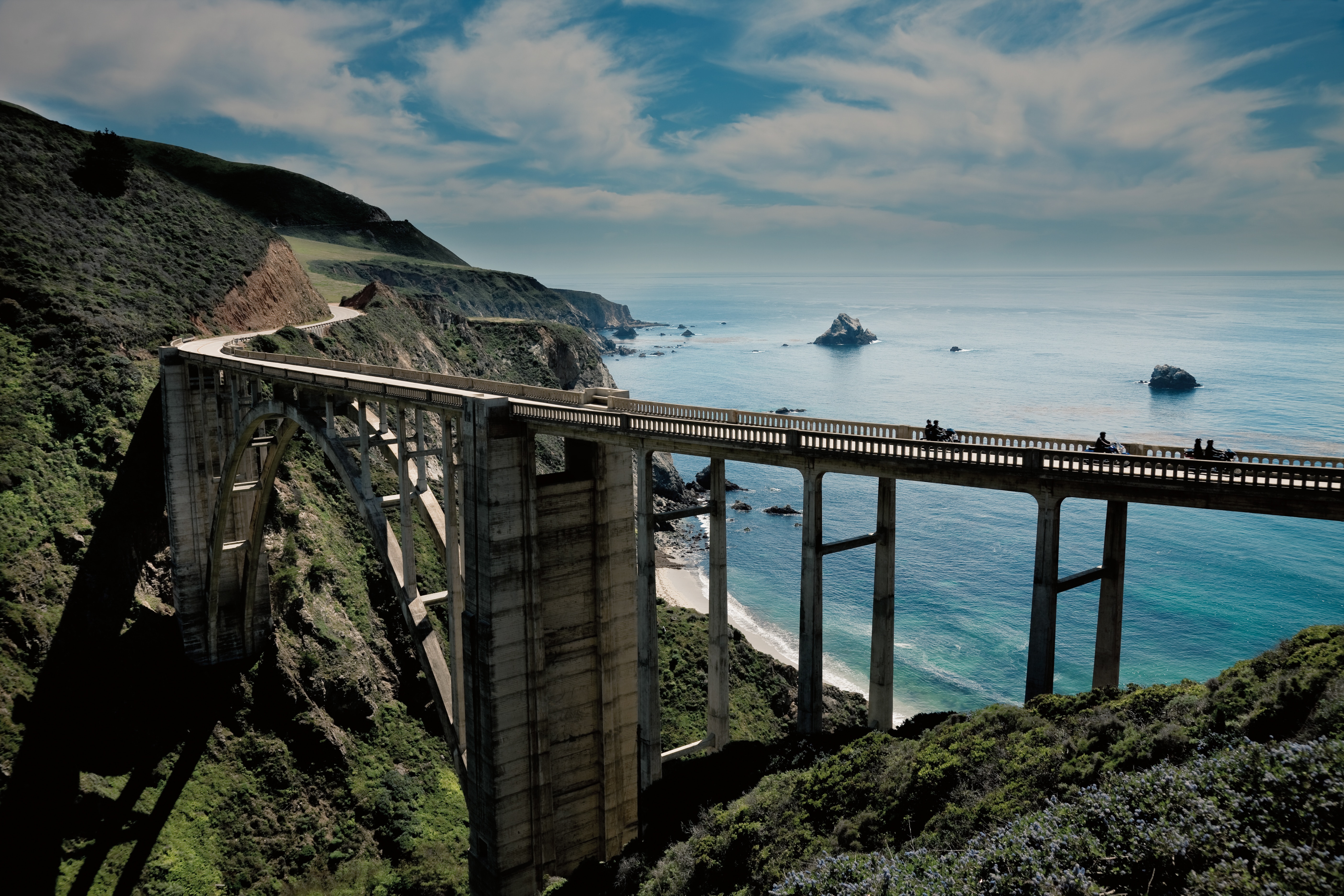 Motorcycle riding across a bridge